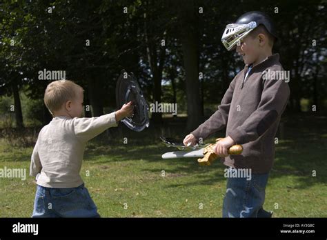 Two Boys Sword Fighting Stock Photo Alamy