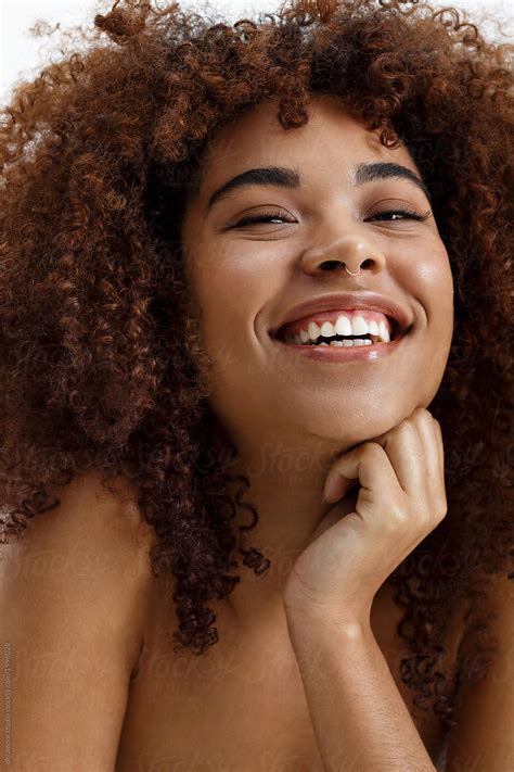 African American Woman Nude Portrait Smiling Naturally Over White
