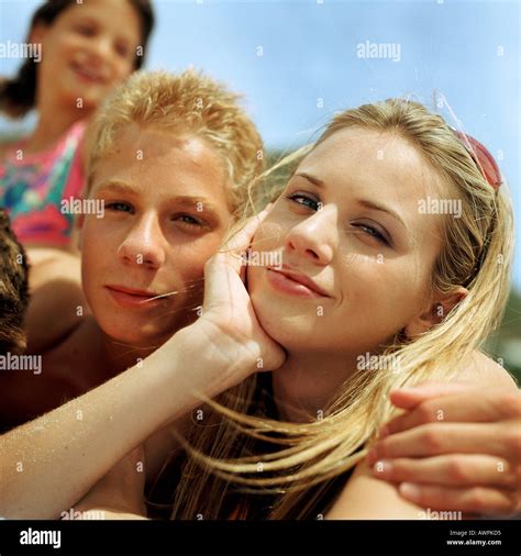 Young People Outside Side By Side Stock Photo Alamy
