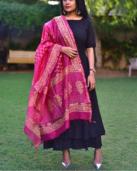 It can be beautifully carried in college with those kolhapuri chapels and black metal jhumkas. Black suit set with pink dupatta by Ambraee | The Secret Label