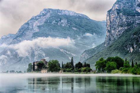 Lake Across Mountain And Trees Photo Free Mountain Image On Unsplash