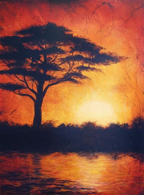 Sunset In Africa In Bright Orange Tones With A Tree