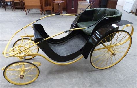 A Victorian Donkey Carriage With Black Coachwork Yellow Chassis And