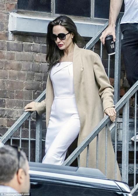 Angelina Jolie Glams Up In A White Frock And Beige Coat At Toronto