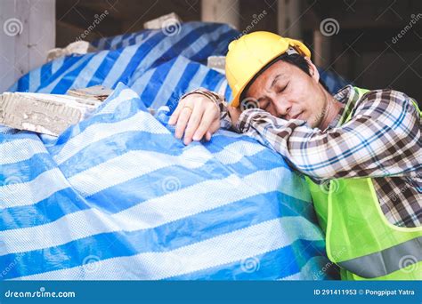 Asian Construction Worker Sleeping At Construction Site Stock Image