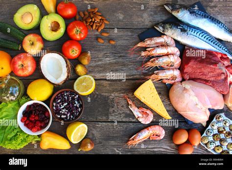 Healthy Food Of Animal And Vegetable Origin On Old Wooden Background