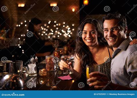 Portrait Of Couple Enjoying Night Out At Cocktail Bar Stock Image Image Of Caucasian Male