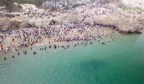 Watch Drone Footage Captures Hundreds Of People Getting Baptized On