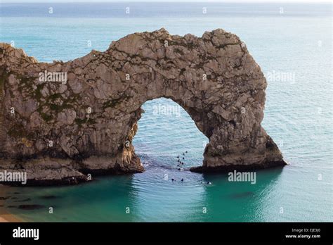 The Sea Arch At Durdle Door On The Jurassic Coast In Dorset On A Calm