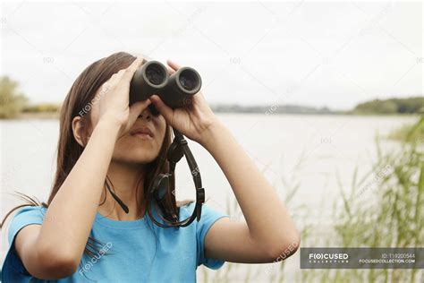 Young Girl With Binoculars — Day Outdoors Stock Photo 119200544