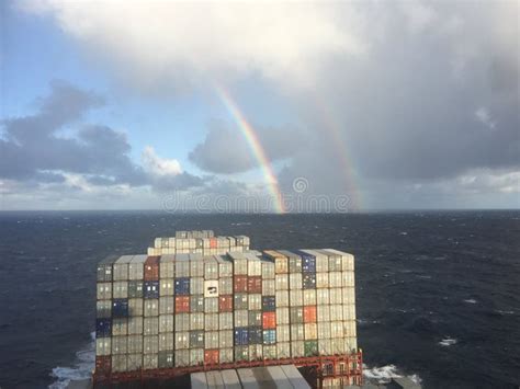 Container Vessel On Atlantic Ocean With Rainbow Stock Photo Image Of