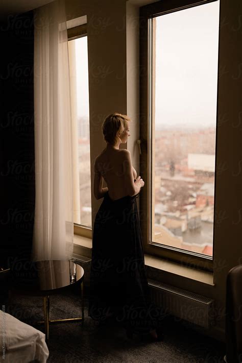 Topless Young Woman Near The Window By Stocksy Contributor Alexey Kuzma Stocksy