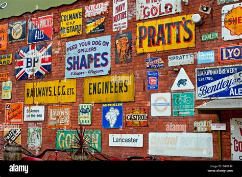 Collection Of Old Metal Signs Displayed On The Wall Of An Former