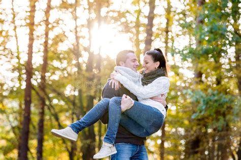 Couple In Love Man Carrying Woman In His Arms Stock Photo Image Of