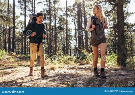 Hiking Couple Walking In Forest Wearing Backpacks Stock Image Image Of Adventure Lifestyle
