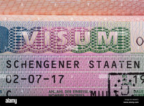 Elevated View Of Visum Text On Passport German Schengen Visa Stock