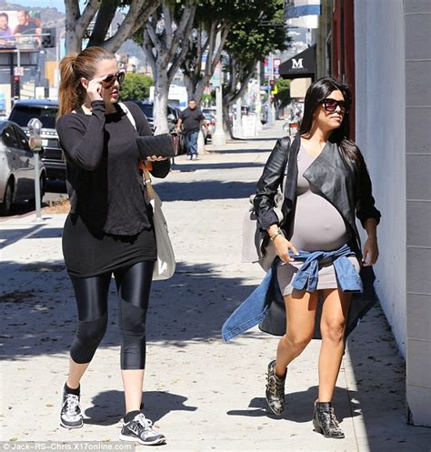 Kourtney Kardashian Struggles To Cover Up Her Bump Wearing Extremely
