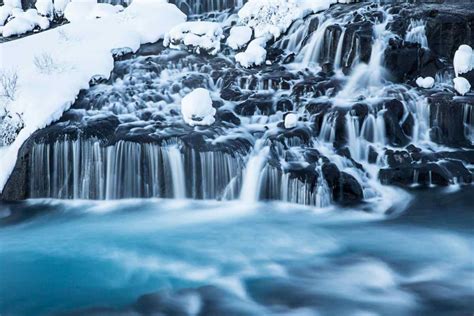 The Enchanting Hraunfossar And Barnafoss Waterfalls