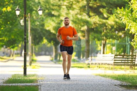 Young Man Running In Park Stock Image Image Of Recreation 125192709