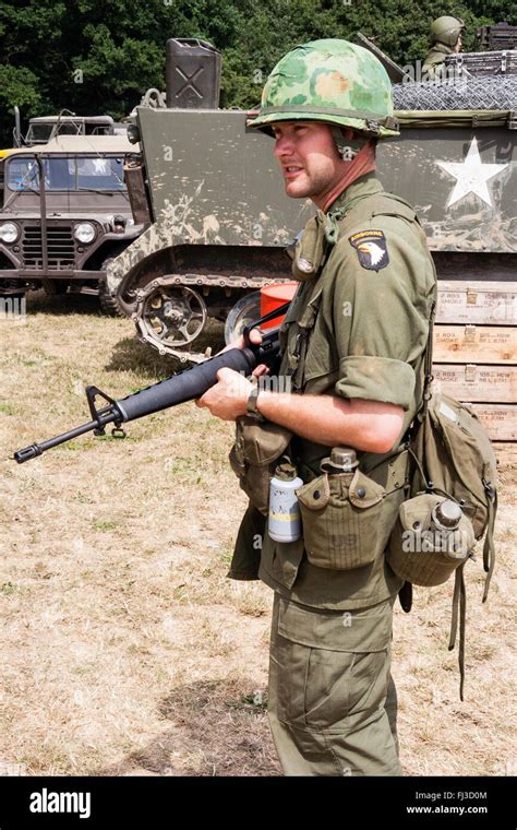 vietnam war period re enactment american soldier on guard duty standing in sunshine holding m16