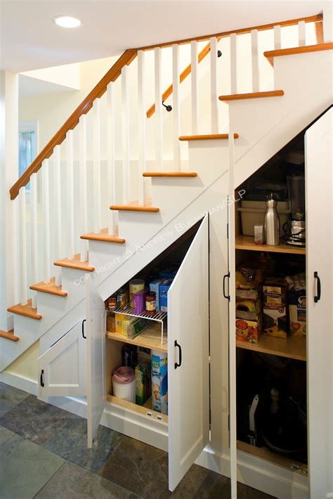 Custom Cabinets Built Under The Stairs Maximize Storage In This Newly