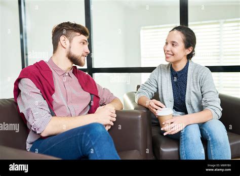 Coworkers Talking Over Coffee Stock Photo Alamy
