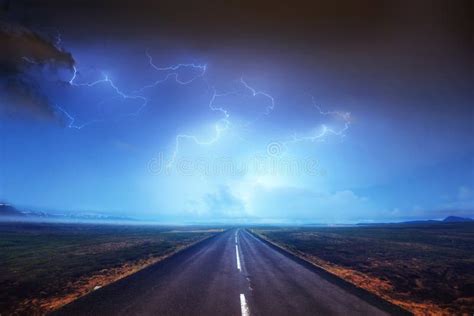 Lightning In Cloudy Dark Sky And Beautiful Asphalt Road Annual Stock