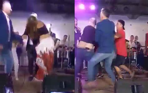 video mujer besa a cantante y su esposo lo ataca