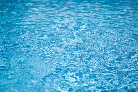 Ripple Water In Swimming Pool With Sun Reflection Blue Water Abstract Background Stock Image