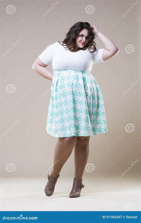 Plus Size Fashion Model In Casual Clothes Fat Woman On Beige Studio