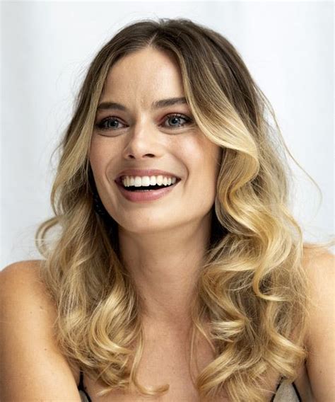 margot robbie long wavy brunette and blonde two tone hairstyle with layered bangs