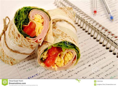 School Lunch Ham And Cheese Wrap Sandwich On Notebook Stock Photo