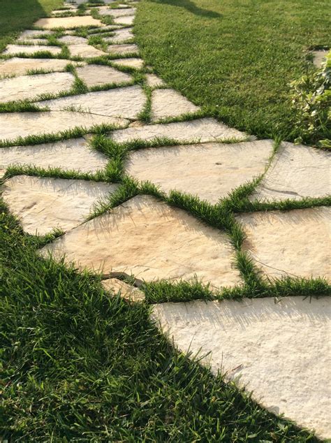 Stone Walkway And Fine Green Grass Done Garden Design Lawn And