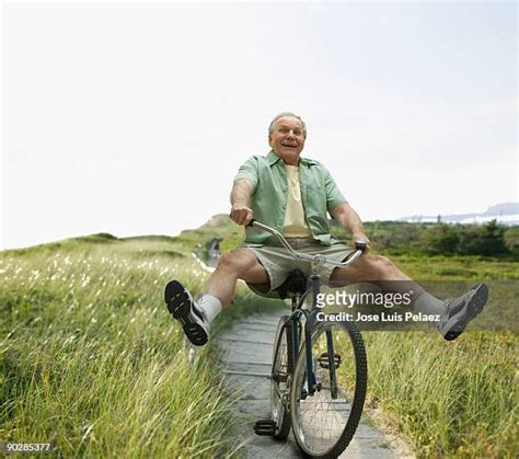 Old Man Riding Bike Photos And Premium High Res Pictures Getty Images