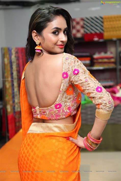 Saree Seduction Pooja Sri In Backless Blouse Orange Saree