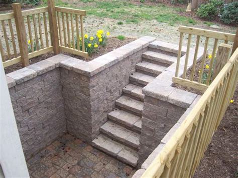 Install your posts at the top and bottom of your stairs. block-retaining-wall-steps-pavers-railing | Ciminelli's ...