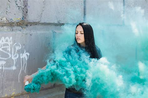 Girl With Green Smoke Bomb By Alexey Kuzma Stocksy United