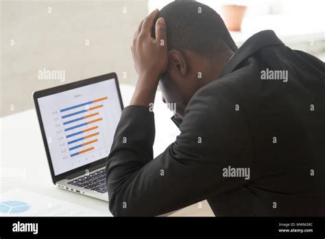 Stressed African American Worker Observing Company Business Coll Stock