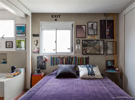 A Bed With Purple Sheets And Pictures On The Wall Next To It In Front Of A Window