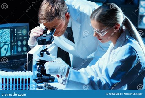 Scientists Working In Modern Lab Doctor Making Microbiology Research