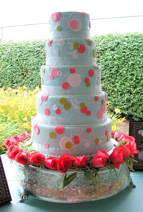 Knoxville catering with rosa's catering service, inc. colorful fondant tiers on a bed of fresh roses. magpies ...