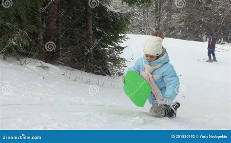 Child Pulling Her Sled Up Snowy Slope Stock Footage Video Of Wind