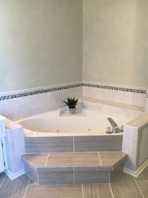 The function of these tiles is to protect the walls from moisture or water splash. Corner bathtub | Tub remodel, Bathtub remodel, Bathtub decor