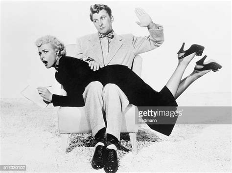 Kirk Douglas Gives Laraine Day A Playful Spanking Between Scenes On