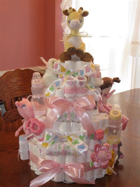 How to make a diaper cake for a baby shower or as a clever homemade gift for a new baby. THE HOBBY LADY: Baby Shower Diaper Cake