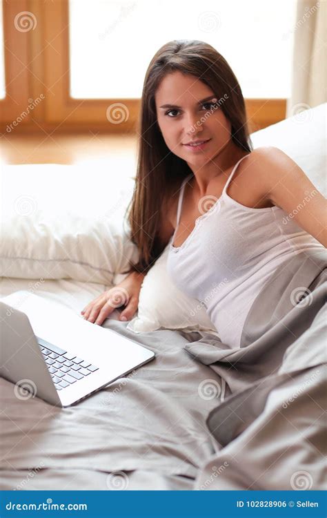Beautiful Brunette Lying On Bed At Home Stock Photo Image Of Skin