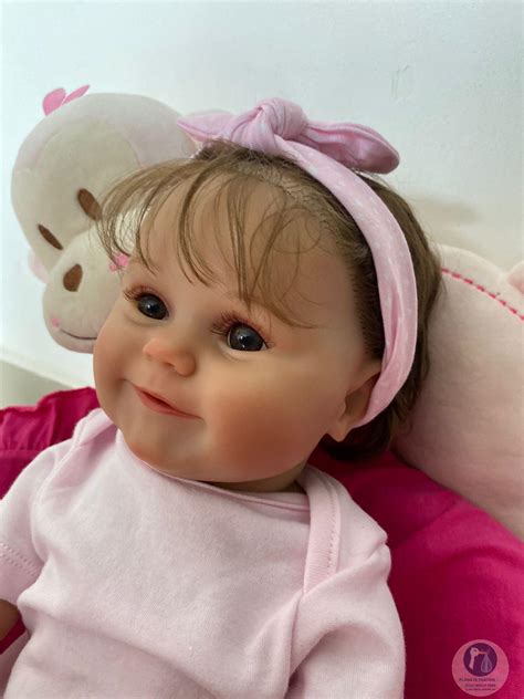 bebê reborn realista maddie corpo todo silicone cabelo implantado fio a fio pode dar banho