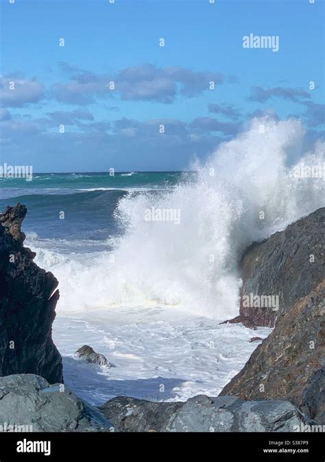 Waves Crashing Into Rocks Stock Photo Alamy