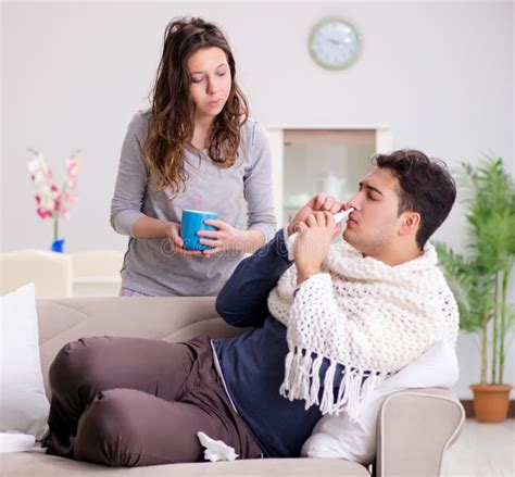 Wife Caring For Sick Husband At Home Stock Photo Image Of Female