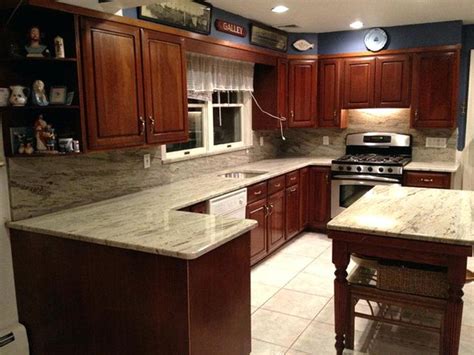 Navy blue kitchen wall white cabinets have the white cabinets. Image result for cherry cabinets with light countertops ...